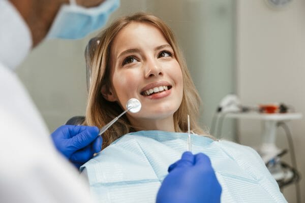 Woman Getting Teeth Cleaning